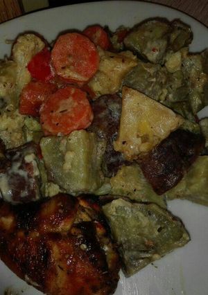 A picture of Grilled chicken with veggies.