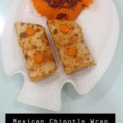 A picture of Mexican chipotle wrap + Baked bean salad.
