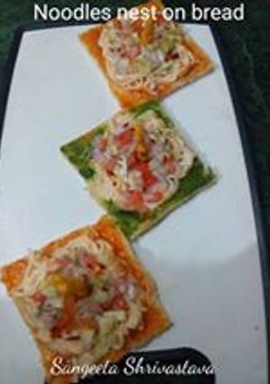 A picture of Noodles nest on bread.