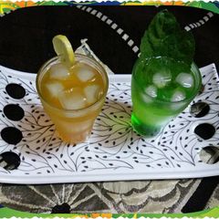 A picture of Khus and orange Sharbat.