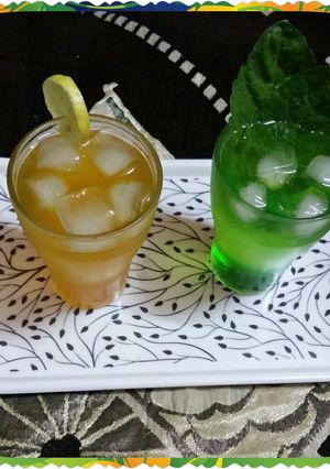A picture of Khus and orange Sharbat.