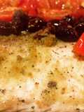 Filetto di branzino al forno con pomodorini e olive taggiasche