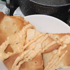 A picture of Gluten free butter pizza with a burger sauce dip.