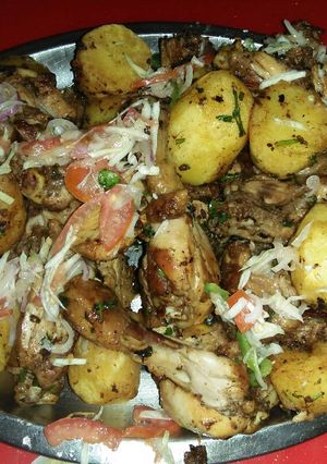 A picture of Grilled Rosemary chicken with dip fried potatoes.