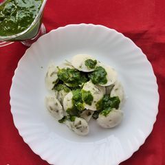 A picture of Ginger Fenugreek Idli With Spinach Sauce.