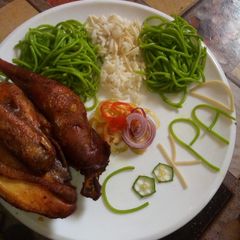 A picture of Coloured Rice and Chicken.