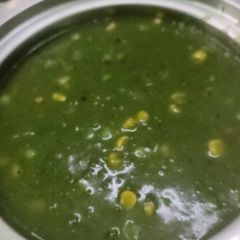 A picture of Winter homemade palak saag, peas, corn soup.