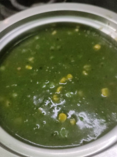 A picture of Winter homemade palak saag, peas, corn soup.