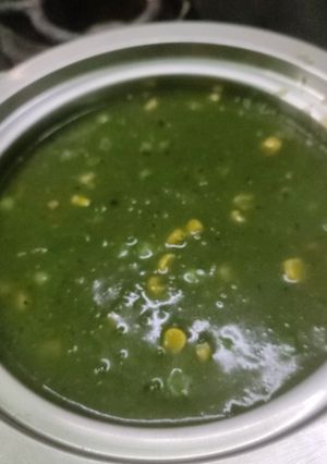 A picture of Winter homemade palak saag, peas, corn soup.
