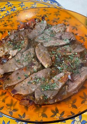 Une photo de Aiguillettes de canard au martini rouge, tomate et oignon