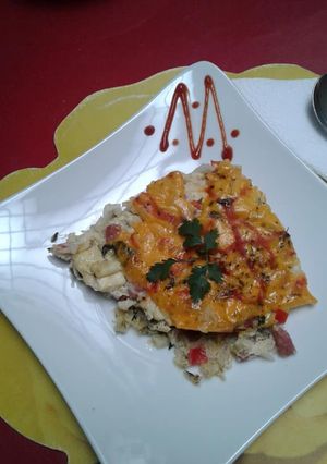 Una foto de Tarta de arroz con albahaca