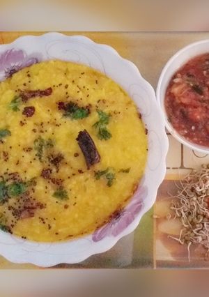 A picture of Rice and Moong dal khichdi with Roasted Tomato Chutni.