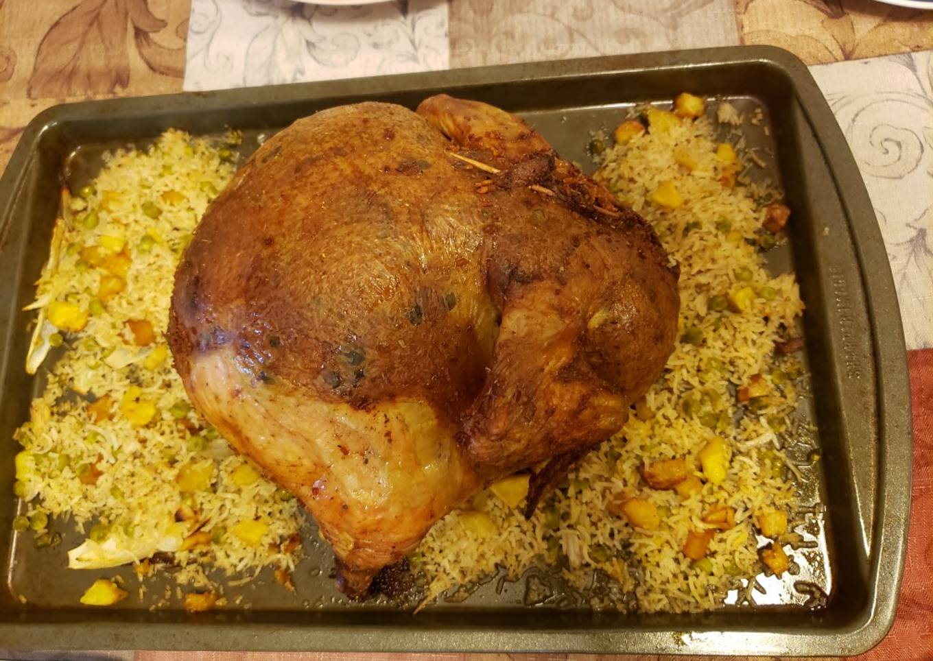 Chicken stuffed with rice, potatoes and peas