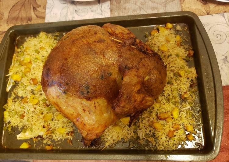 Chicken stuffed with rice, potatoes and green peas