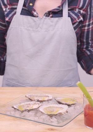 A picture of Bloody Mary and oysters.