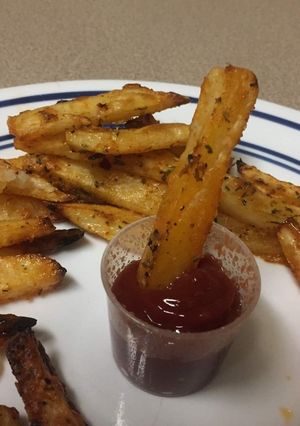 A picture of Potato wedgesPotato wedges are delicious potatoes bites seasoned with herbs and chilli flakes.