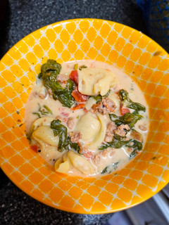 A picture of Tortellini Soup in a Crockpot.