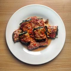 A picture of Aubergine rolls with spinach & ricotta.