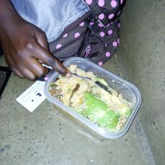 A picture of Mixed rice with vegetables and ovacado.