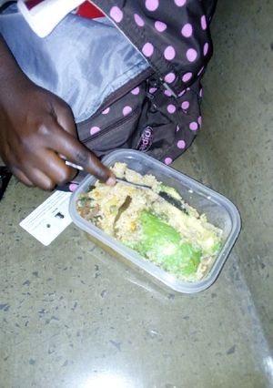A picture of Mixed rice with vegetables and ovacado.