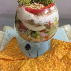 A picture of Greek layered elbow pasta salad.