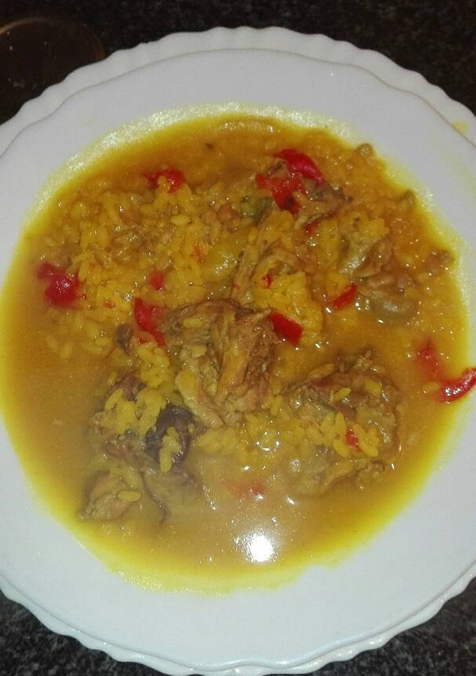 Una foto de Arroz caldoso con conejo de campo