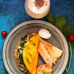 A picture of Stuffed Omelet with Cheesy Tomato.