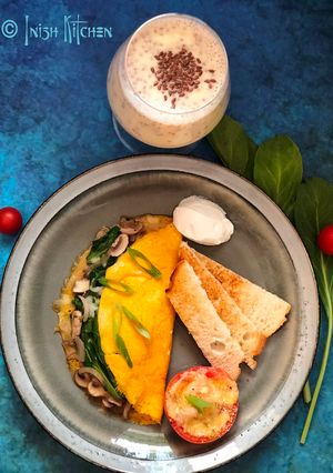 A picture of Stuffed Omelet with Cheesy Tomato.