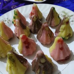 A picture of Triflavoured flattened rice and Paneer Modaks.