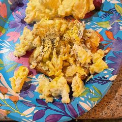 A picture of Open faced egg sandwiches.