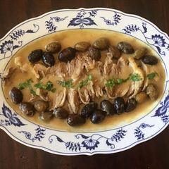 A picture of California Farm Duck with olives dinner.