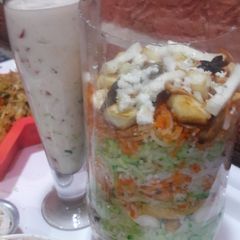 A picture of PANEER Biryani with Curd.