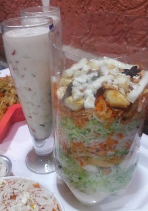 A picture of PANEER Biryani with Curd.