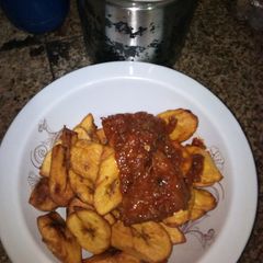 A picture of Fried plantain and stew.