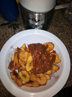 A picture of Fried plantain and stew.