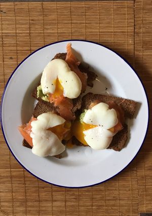 A picture of Perfect poached eggs with salmon & avocado on rye.