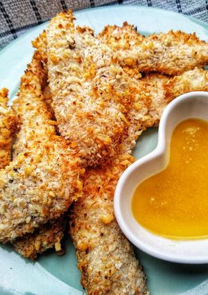 A picture of Coconut Chicken Tenders With A Honey & Mustard Dip.