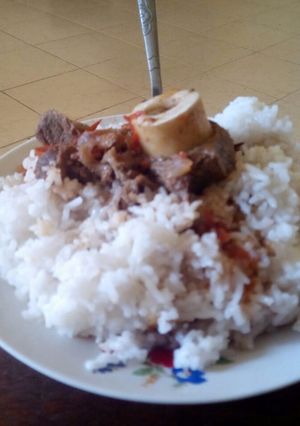A picture of Rice with stew beef.