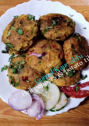 A picture of Bell peppers & potato patties 🫑🥔🧅🌶️🧄🌻.