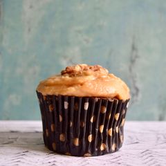 A picture of Coffee & Walnut Cupcakes with Caramel Icing.