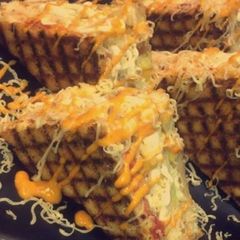 A picture of Schezwan grilled cheese sandwich.