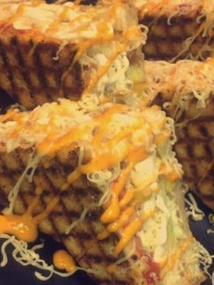 A picture of Schezwan grilled cheese sandwich.