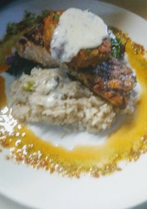 A picture of Grilled Salmon Parm Rice Swiss Chard w/Crab Cake and Dill Butter.