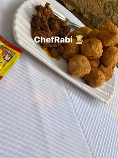 A picture of Yam balls and beef sauce.