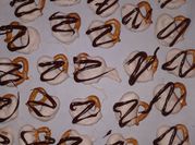 A picture of pretzels with white chocolate
