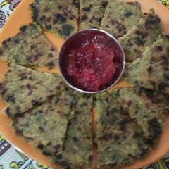 Mix sag Partha with tangy tomato chutney A picture of Mix sag Partha with tangy tomato chutney.