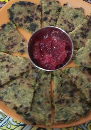A picture of Mix sag Partha with tangy tomato chutney.