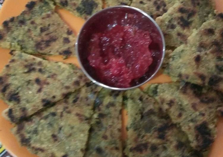 Mix sag Partha with tangy tomato chutney