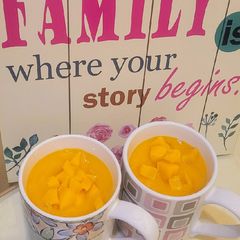 A picture of Mango Shake with Mango Bits.