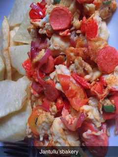 A picture of Fried yam and Egg sauce for a breakfast.